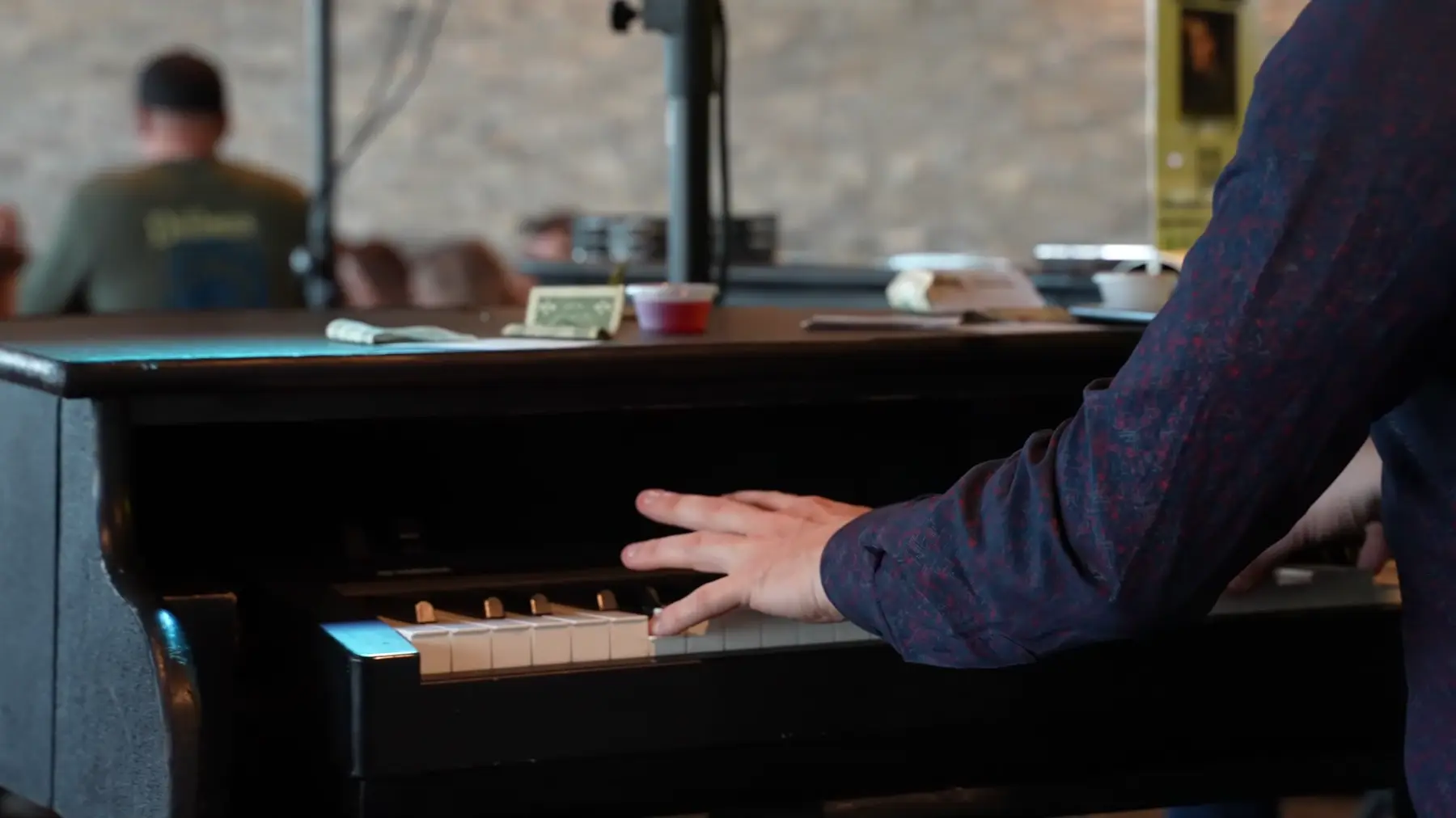A pianist playing during a Midwest Dueling Pianos performance